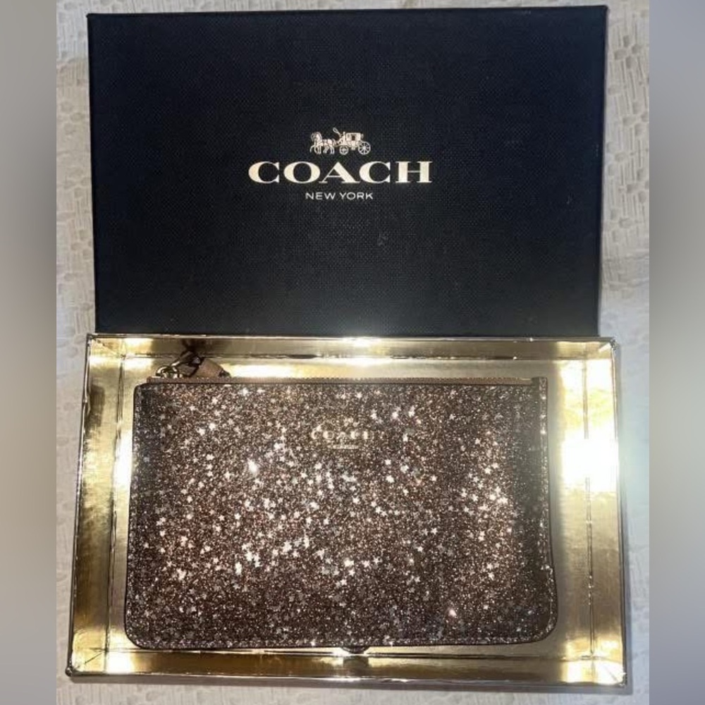 Coach star and sparkle rose gold wristlet